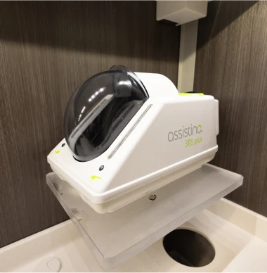 Assistina 301 plus dental handpiece maintenance unit on counter.