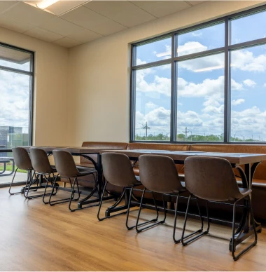 Dental office breakroom with modern seating and large windows